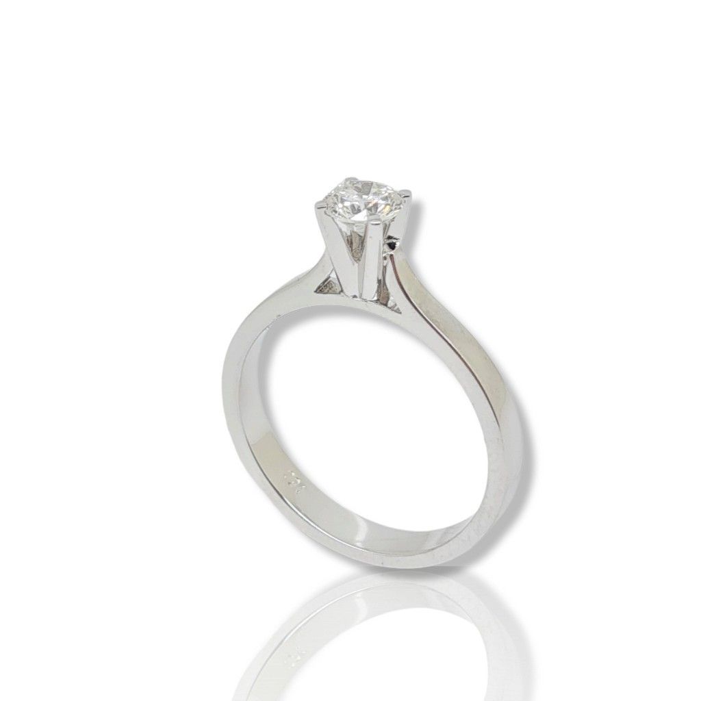 Μονόπετρο δαχτυλίδι απο λευκόχρυσο κ18 με πλακέ σκελετό και διαμάντι δεμένο σε καστόνι με τέσσερα δόντια (code T2007)